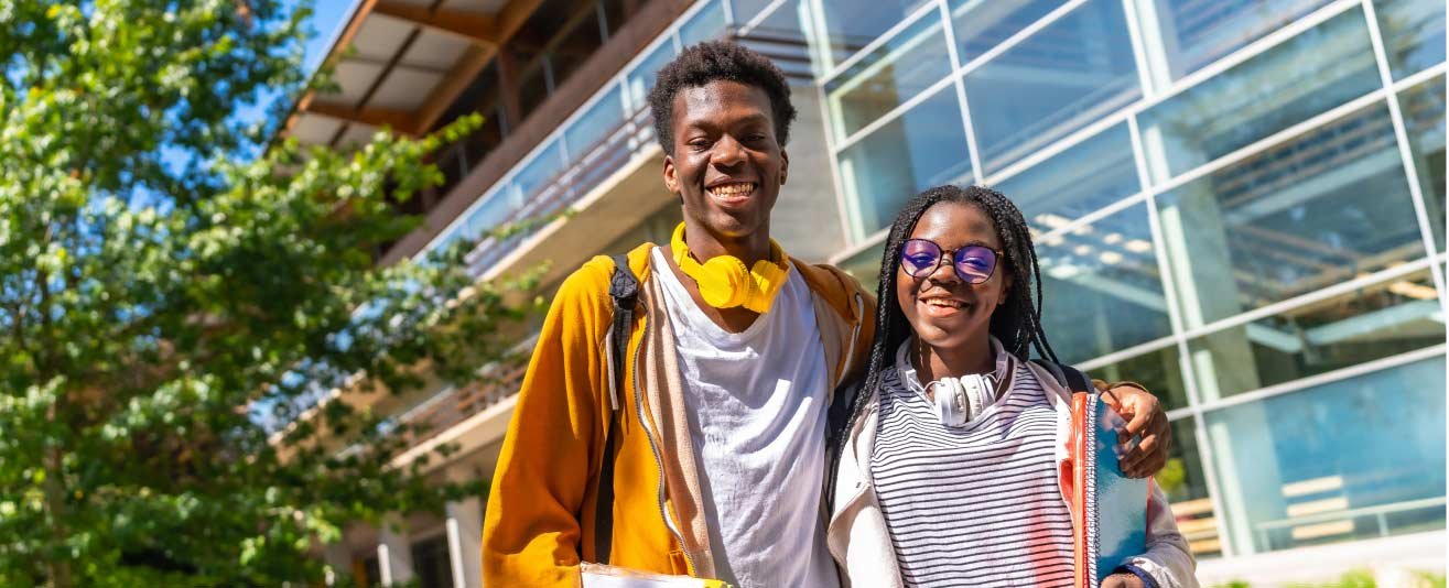 Smiling male and female student